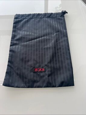 Tumi Black Drawstring Travel Pouch with Red Logo